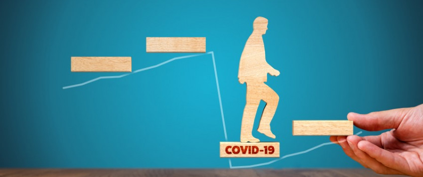 Illustrative picture with supporting hand in Covid-19 crisis
