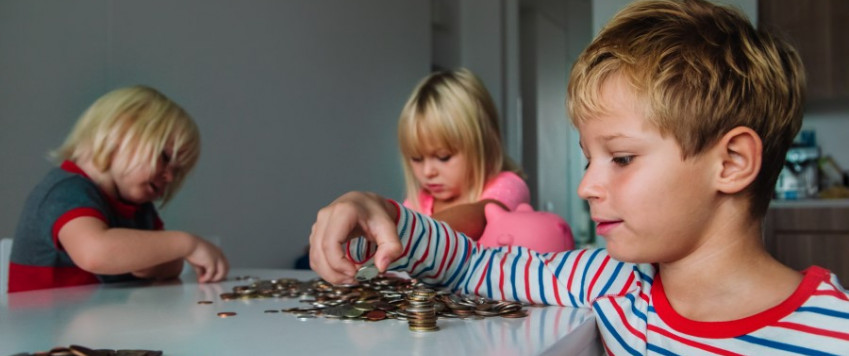 Illustrative picture with three kids counting money