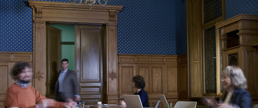 Illustrative photo of people in a meeting room